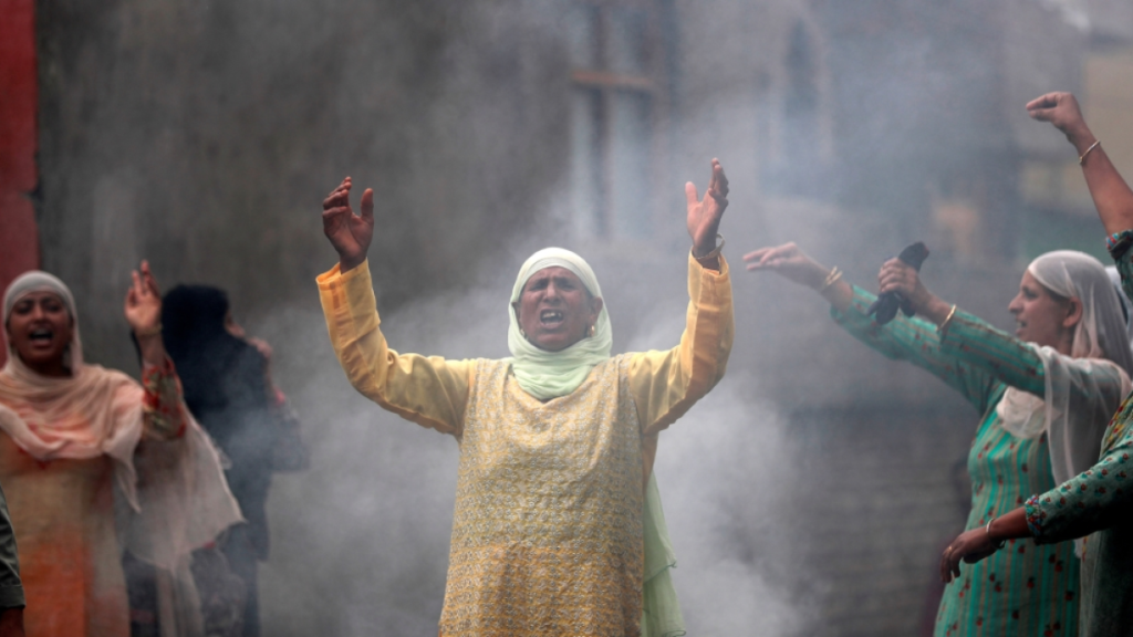 Kashmiris raising slogans during a protest following restrictions after the government scrapped the special constitutional status for Kashmir, in Srinagar August 14, 2019. REUTERS/Danish Ismail [Daylife]