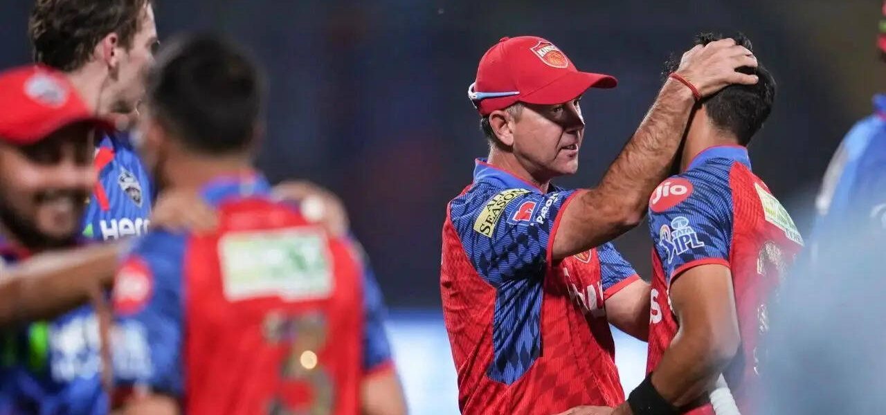 The Paradox of Perfection: IPL’s Unbeaten Kings Face Coach’s Scrutiny Amidst Economic Whirlwind
