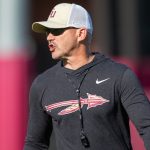 Gridiron Guillotines: The Brutal Economics of Collegiate Glory in a World Adrift