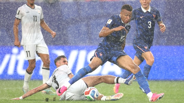 Mbappe’s Double Propels France to World Cup Knockout Stage, Weather Delay Notwithstanding