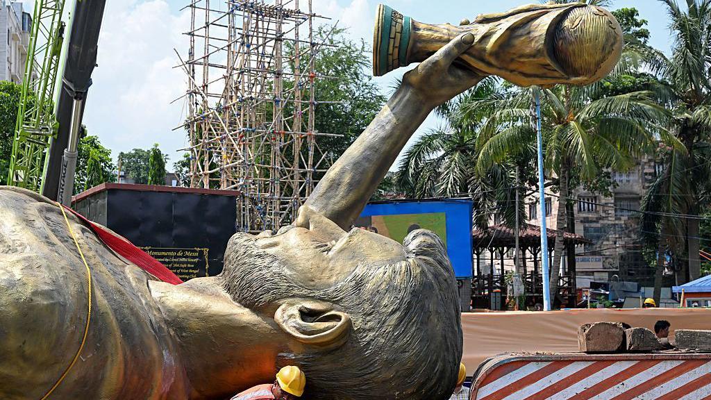 Messi’s Humbling: India’s Giant Idol Topples Amidst Bureaucratic Scrutiny