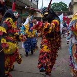 Infernal Rhythms: Venezuela’s Dancing Devils Persist Amidst Lingering Despair