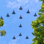 Bastille Day’s Glitzy Pomp: Macron’s Ukrainian Gambit Under a Stormy European Sky