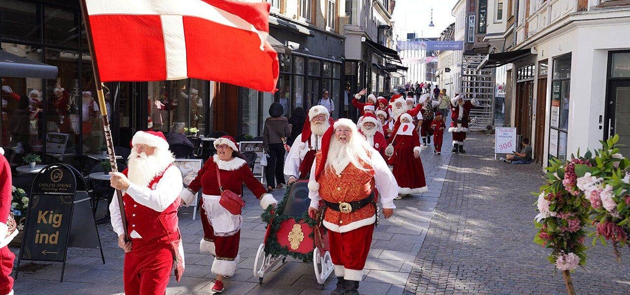 Red Suits and Sunstroke: Santa’s Mid-Summer March Sparks Wry Reflection