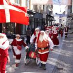 Red Suits and Sunstroke: Santa’s Mid-Summer March Sparks Wry Reflection