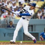 Ohtani’s Knee Fluid: Dodgers Star Navigates Health, Global Economic Pressure
