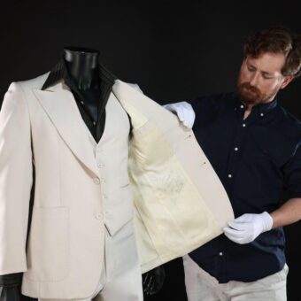 John Travolta’s Iconic ‘Saturday Night Fever’ Suit Among Movie Props Auctioned