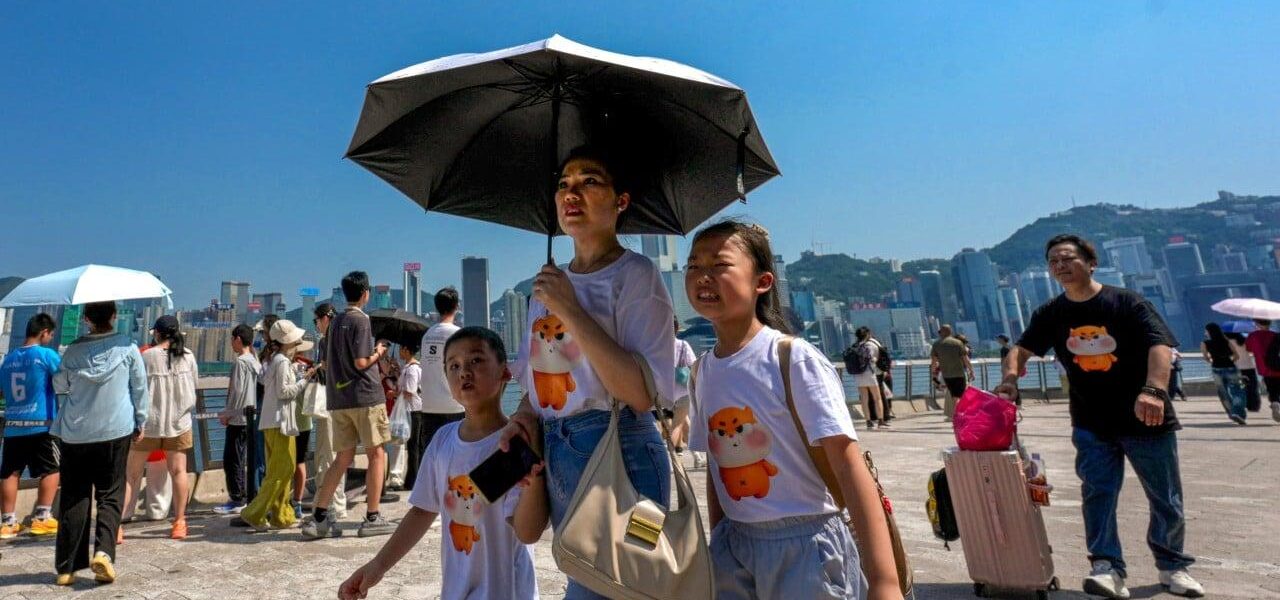 Hong Kong Sets New Record for Hottest Day Amid Typhoon Dolphin Hong Kong Sets New Record for Hottest Day Amid Typhoon Dolphin