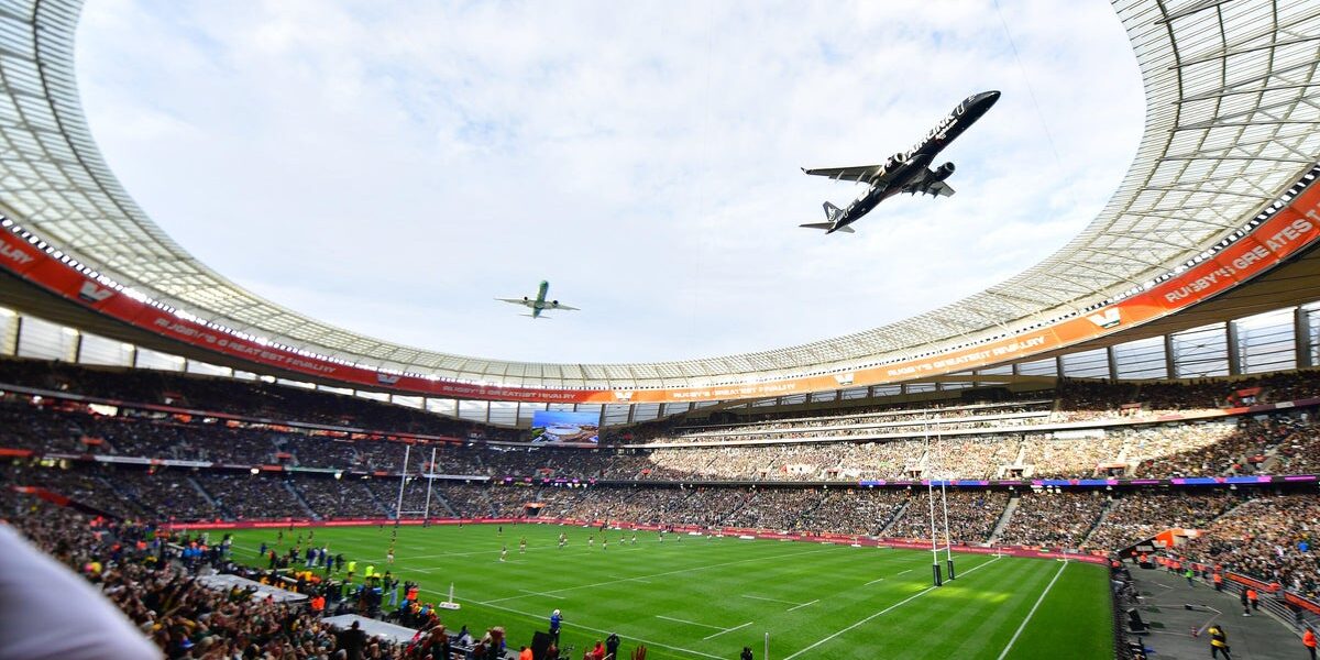 Spectator Awestruck by Daring Low Flyover at Cape Town Rugby Stadium