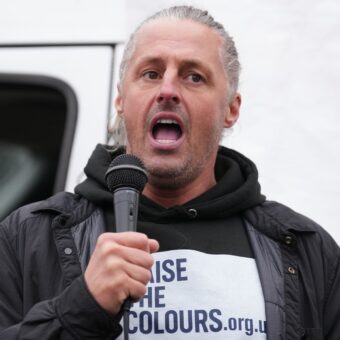 Activist Leader Faces Multiple Charges for Flag Campaign