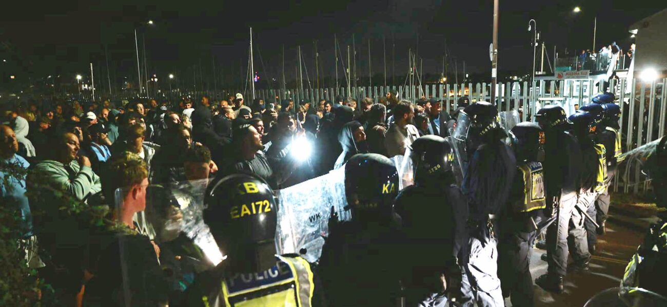 Violence Erupts During Anti-Migrant Protest as Officers Injured and Vehicles Damaged