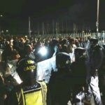 Violence Erupts During Anti-Migrant Protest as Officers Injured and Vehicles Damaged