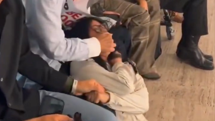 Fashion CEO Confronts Animal Rights Protester at NYFW Show